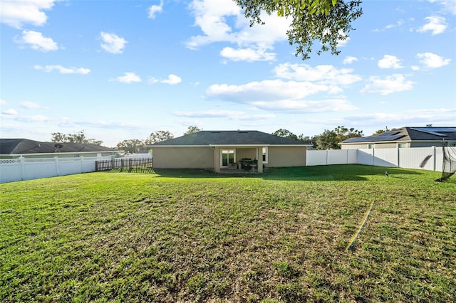 rear view of house with a yard