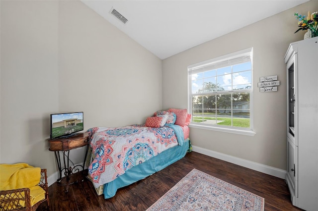 bedroom featuring dark hardwood / wood-style floors and vaulted ceiling