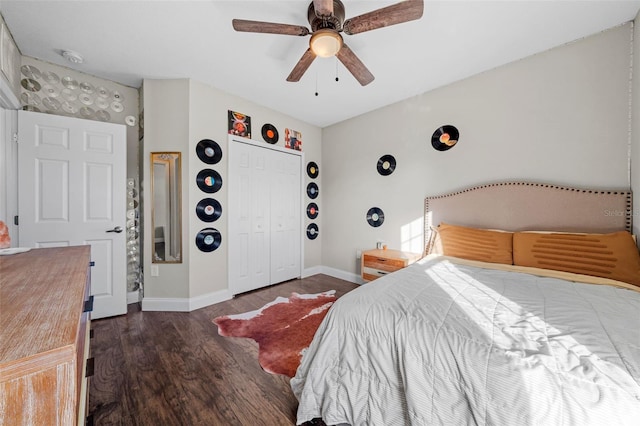 bedroom featuring ceiling fan, dark hardwood / wood-style flooring, and a closet