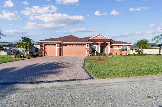 view of front of house with a front lawn and a garage