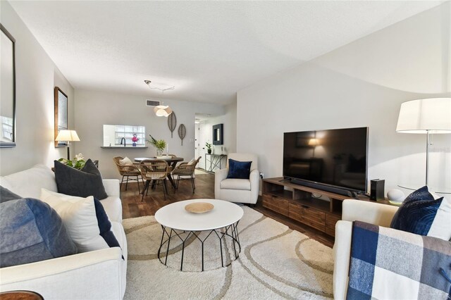 living room featuring dark hardwood / wood-style flooring