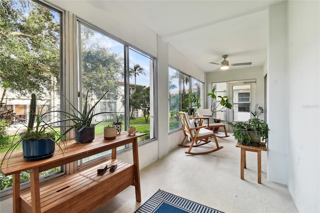 sunroom featuring ceiling fan