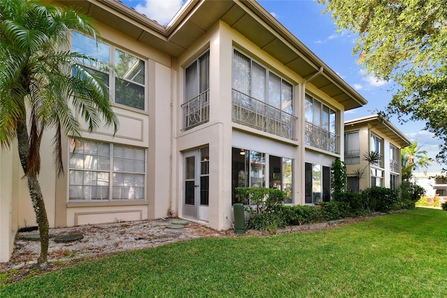 view of home's exterior with a lawn