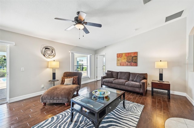 living room featuring dark hardwood / wood-style floors, ceiling fan, and lofted ceiling