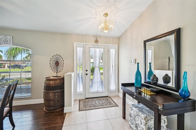 foyer featuring a chandelier and light hardwood / wood-style floors