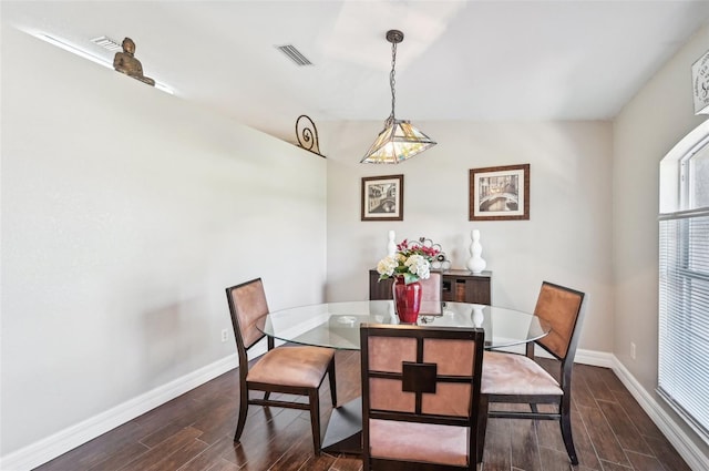 dining area featuring dark hardwood / wood-style flooring