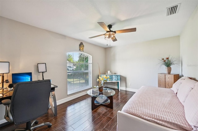 bedroom with dark hardwood / wood-style flooring and ceiling fan