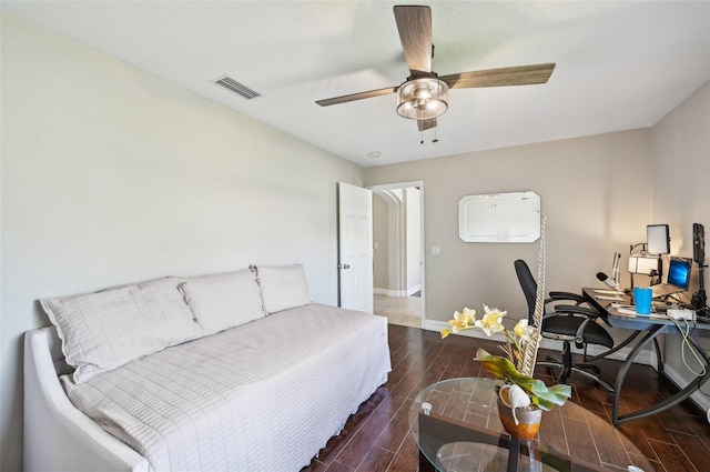 bedroom with ceiling fan and dark hardwood / wood-style flooring