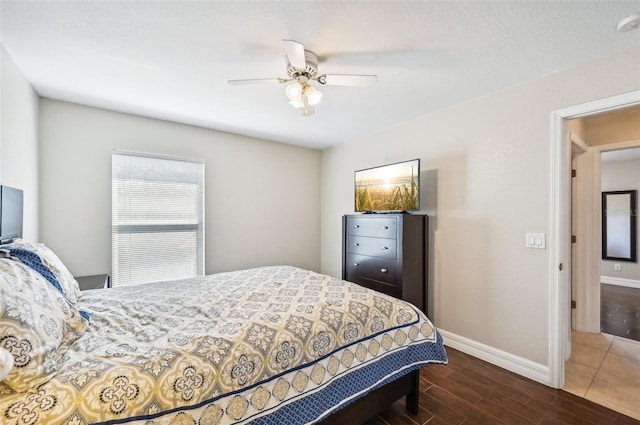 bedroom featuring ceiling fan and hardwood / wood-style floors