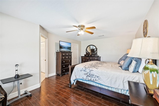 bedroom with ceiling fan and dark wood-type flooring