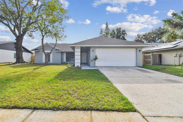 ranch-style home with a garage and a front lawn