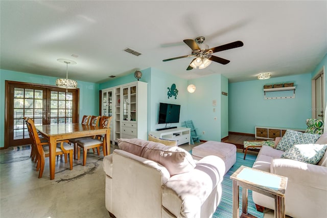 living room with ceiling fan and french doors