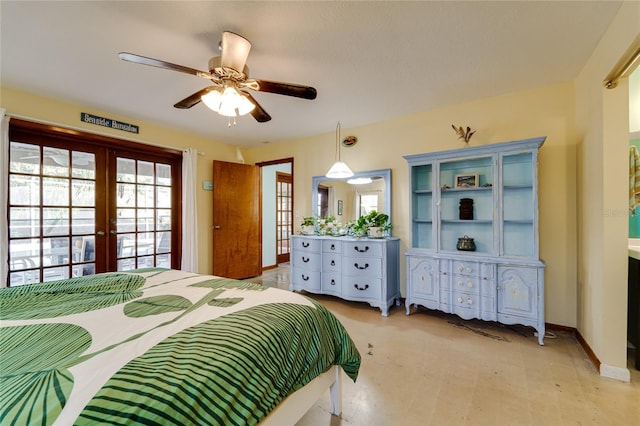 bedroom with french doors and ceiling fan