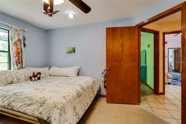 bedroom featuring ceiling fan and light colored carpet