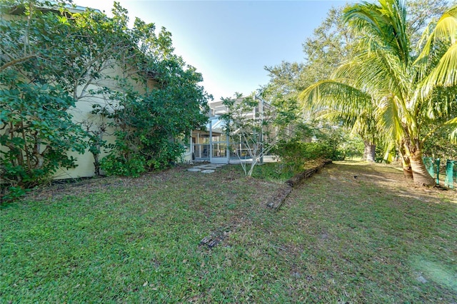 view of yard with a lanai