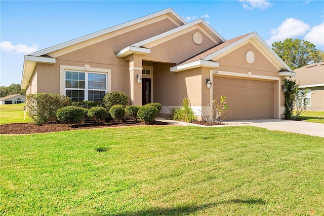 view of front of house featuring a garage and a front lawn