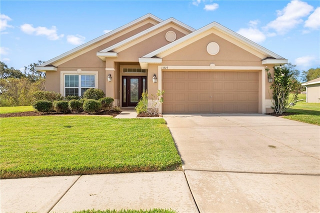 view of front of home with a garage and a front yard