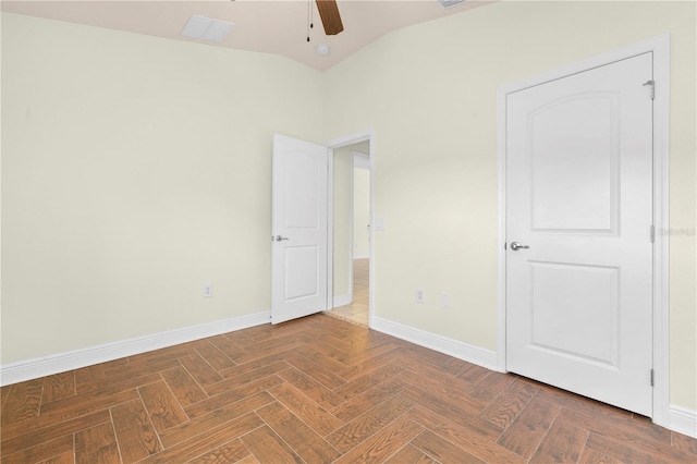 unfurnished room featuring ceiling fan, lofted ceiling, and parquet floors