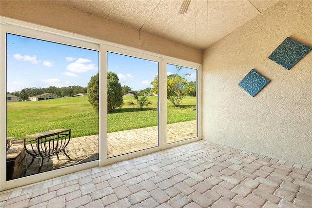 unfurnished sunroom with vaulted ceiling