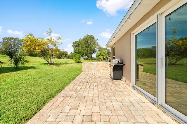 view of patio featuring a grill