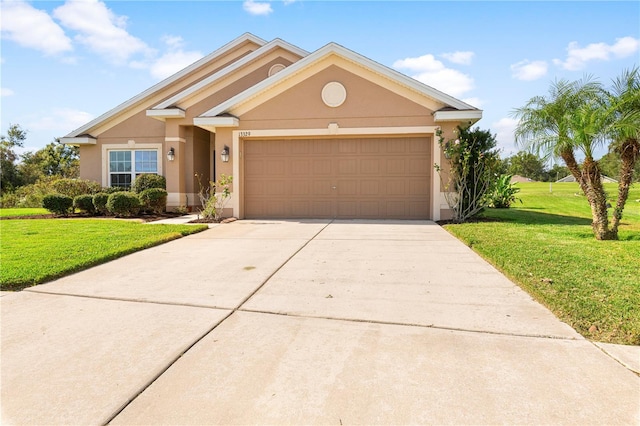 view of front facade featuring a garage and a front lawn