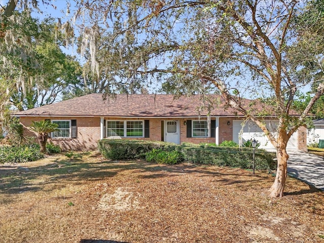 ranch-style home featuring a garage