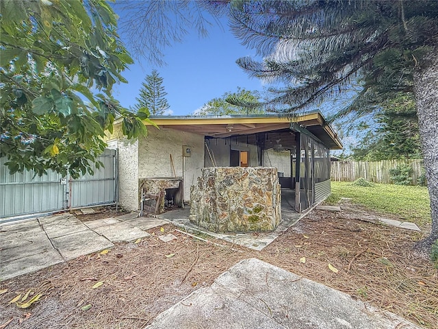 back of property featuring a sunroom