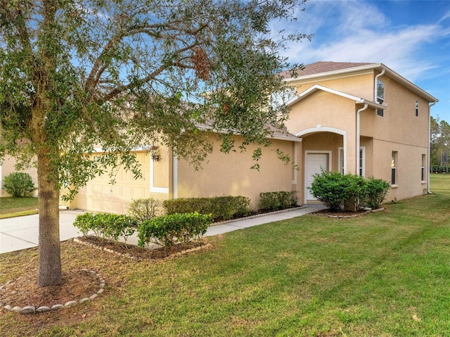30619 White Bird Ave, Wesley Chapel, FL 33543 - view of front facade featuring an attached garage, a front lawn, stucco siding, and driveway