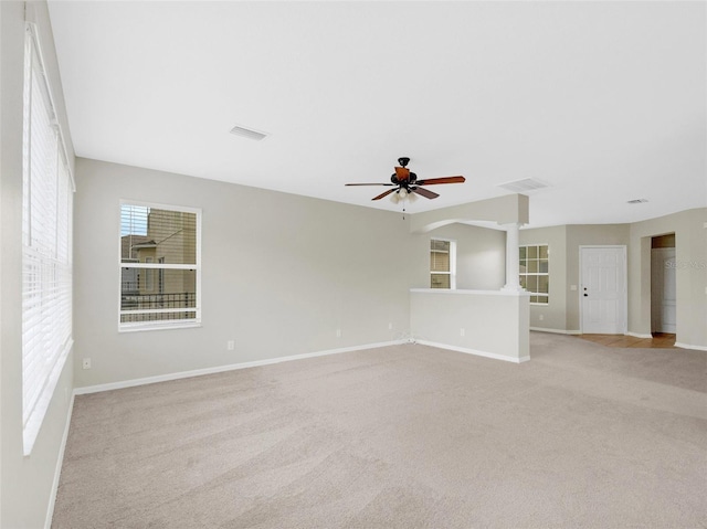 empty room featuring light carpet and ceiling fan