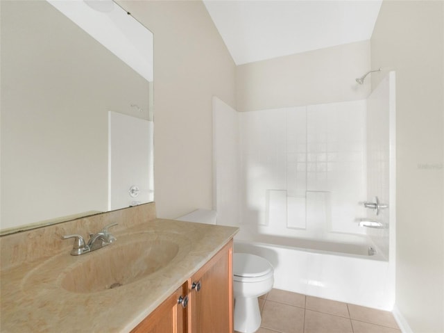 full bathroom with vanity, lofted ceiling, bathtub / shower combination, tile patterned floors, and toilet