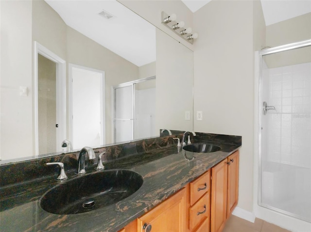 bathroom with vanity, an enclosed shower, and vaulted ceiling