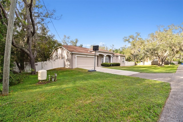 view of front of home featuring a front yard and a garage