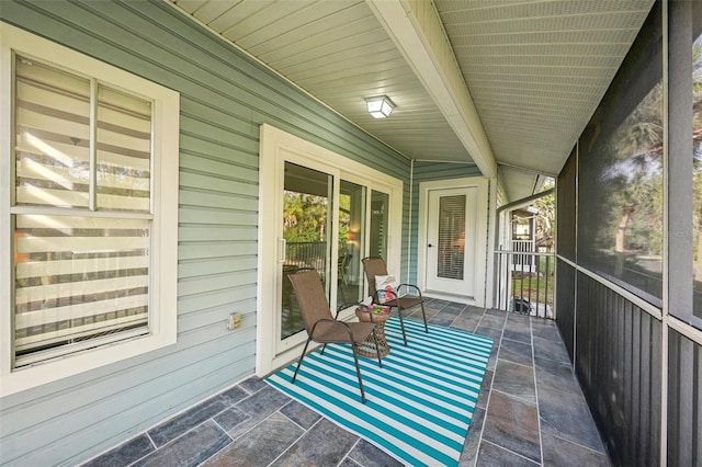 sunroom / solarium with beam ceiling and wood ceiling