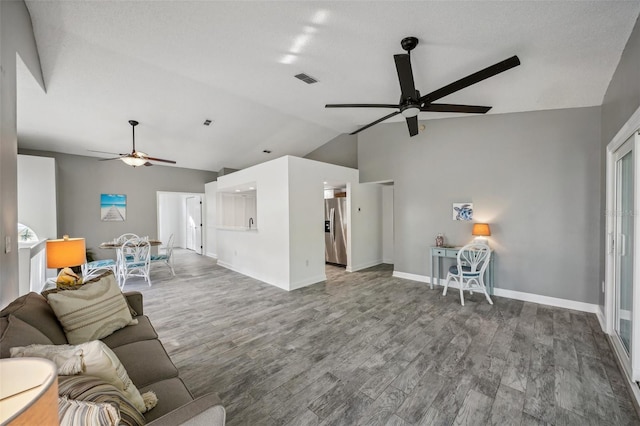 unfurnished living room featuring hardwood / wood-style flooring, ceiling fan, and lofted ceiling