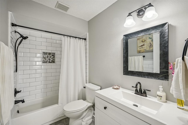 full bathroom with vanity, shower / tub combo, a textured ceiling, and toilet