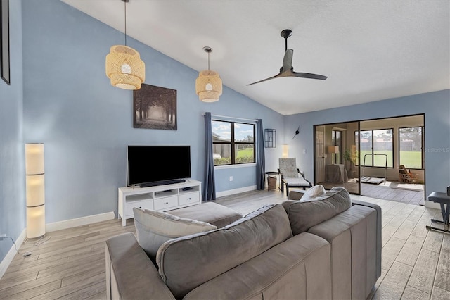 living room with vaulted ceiling and ceiling fan