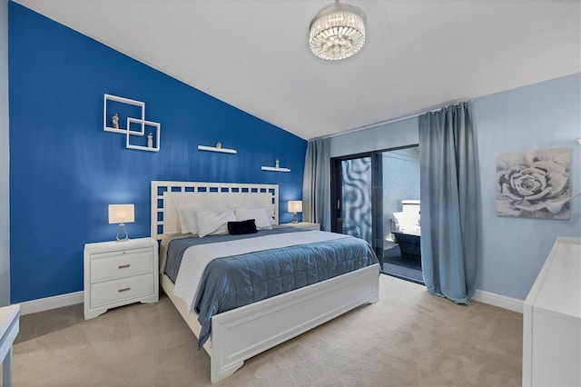 bedroom with light carpet, a notable chandelier, and vaulted ceiling