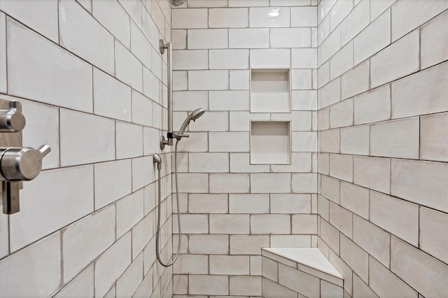 bathroom with tiled shower