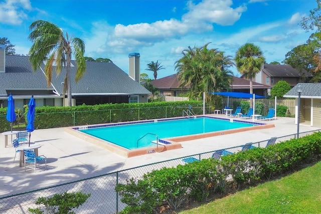 view of swimming pool featuring a patio