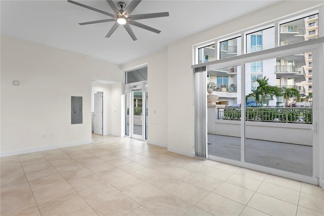 450 Knights Run Ave Unit 407, Tampa, FL 33602 - unfurnished room featuring a ceiling fan, electric panel, light tile patterned floors, and baseboards