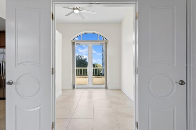 450 Knights Run Ave Unit 407, Tampa, FL 33602 - hallway with baseboards, french doors, and light tile patterned floors