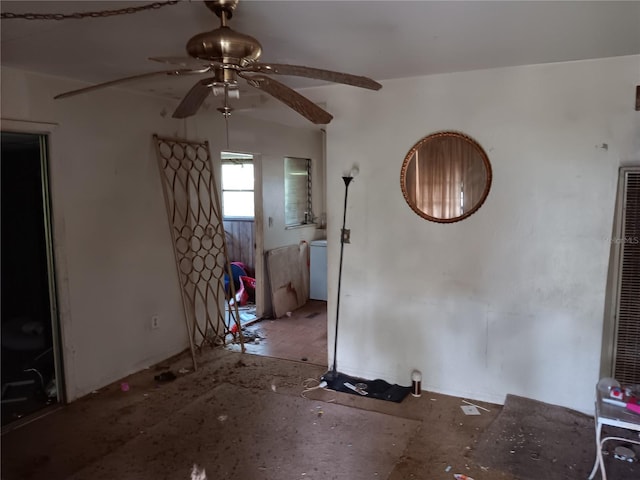 interior space with ceiling fan