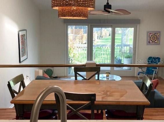 dining space featuring ceiling fan and hardwood / wood-style floors