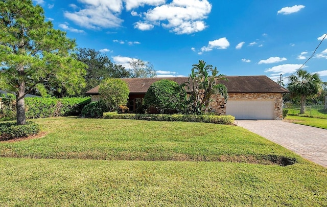 view of front of house with a front lawn and a garage