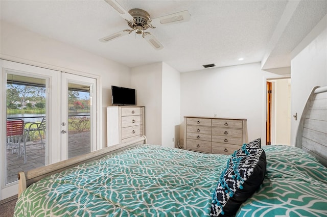 bedroom with access to exterior, french doors, a textured ceiling, and ceiling fan