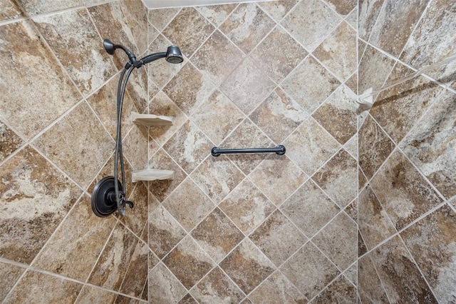 interior details with a tile shower