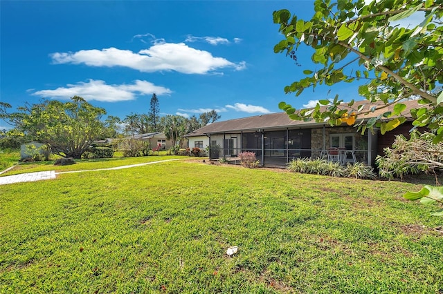 view of yard with a sunroom