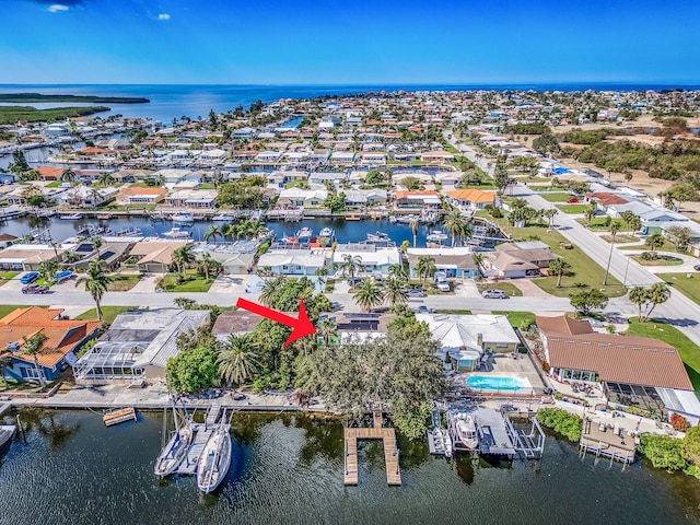 birds eye view of property featuring a water view