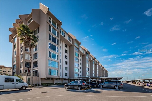 632 Edgewater Dr Unit 532, Dunedin, FL 34698 - view of apartment building / complex featuring covered parking