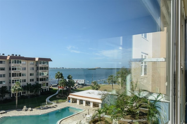 view of swimming pool with a water view